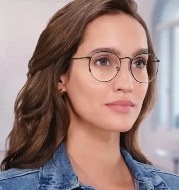 Person wearing Crizal anti-reflective lenses